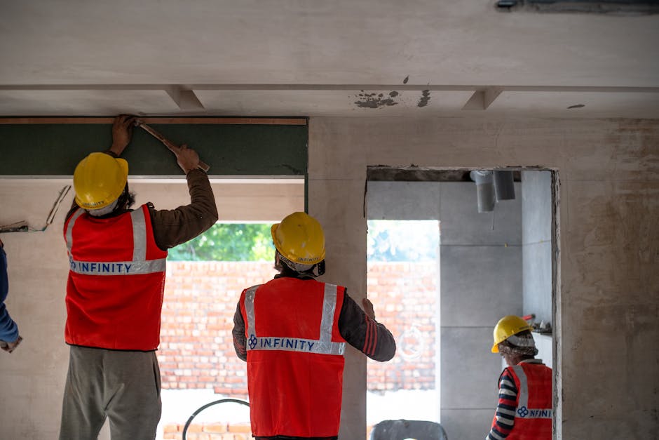 Professional window installer working carefully on a new window fitting